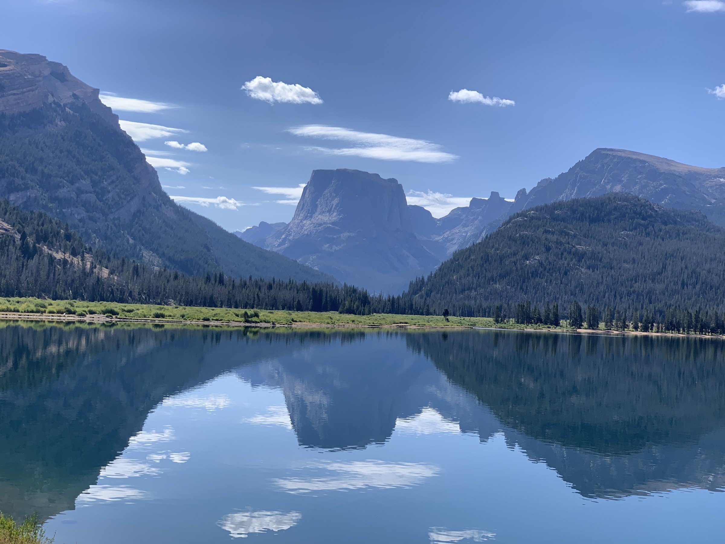 Mountains reflected in the still water of Green River Lakes