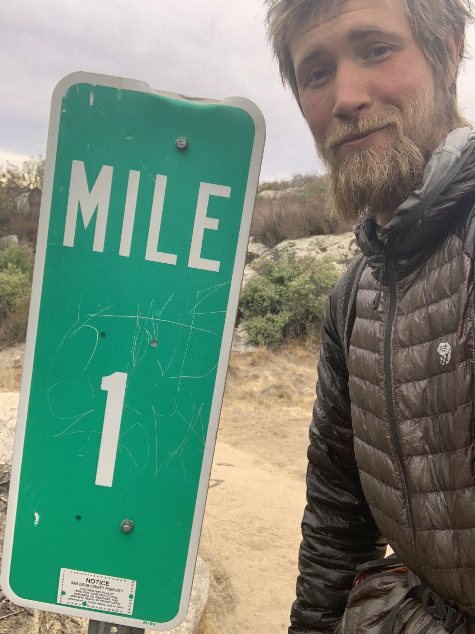 Mile marker beside the trail