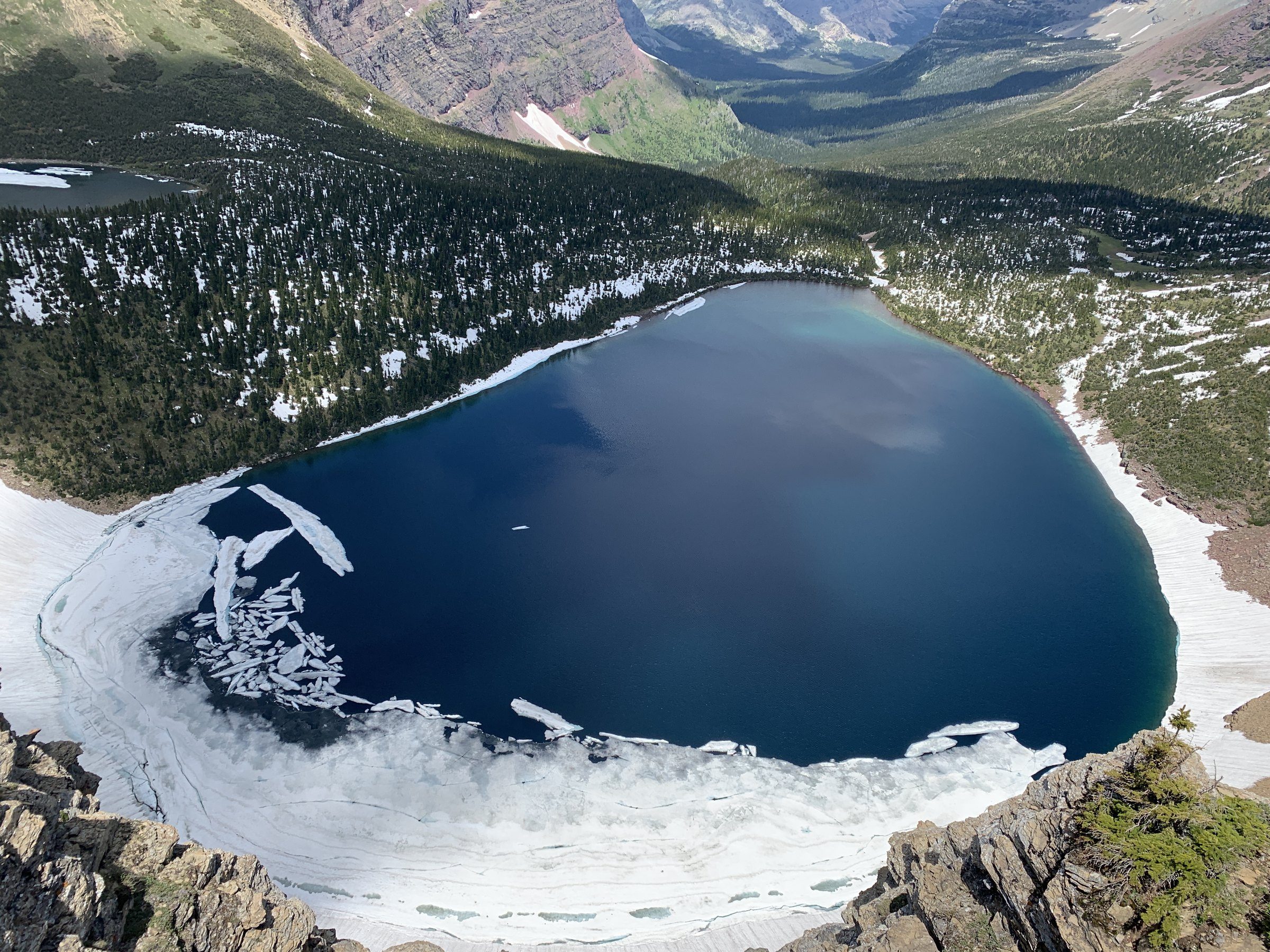 Blue alpine lake surrounded by rock