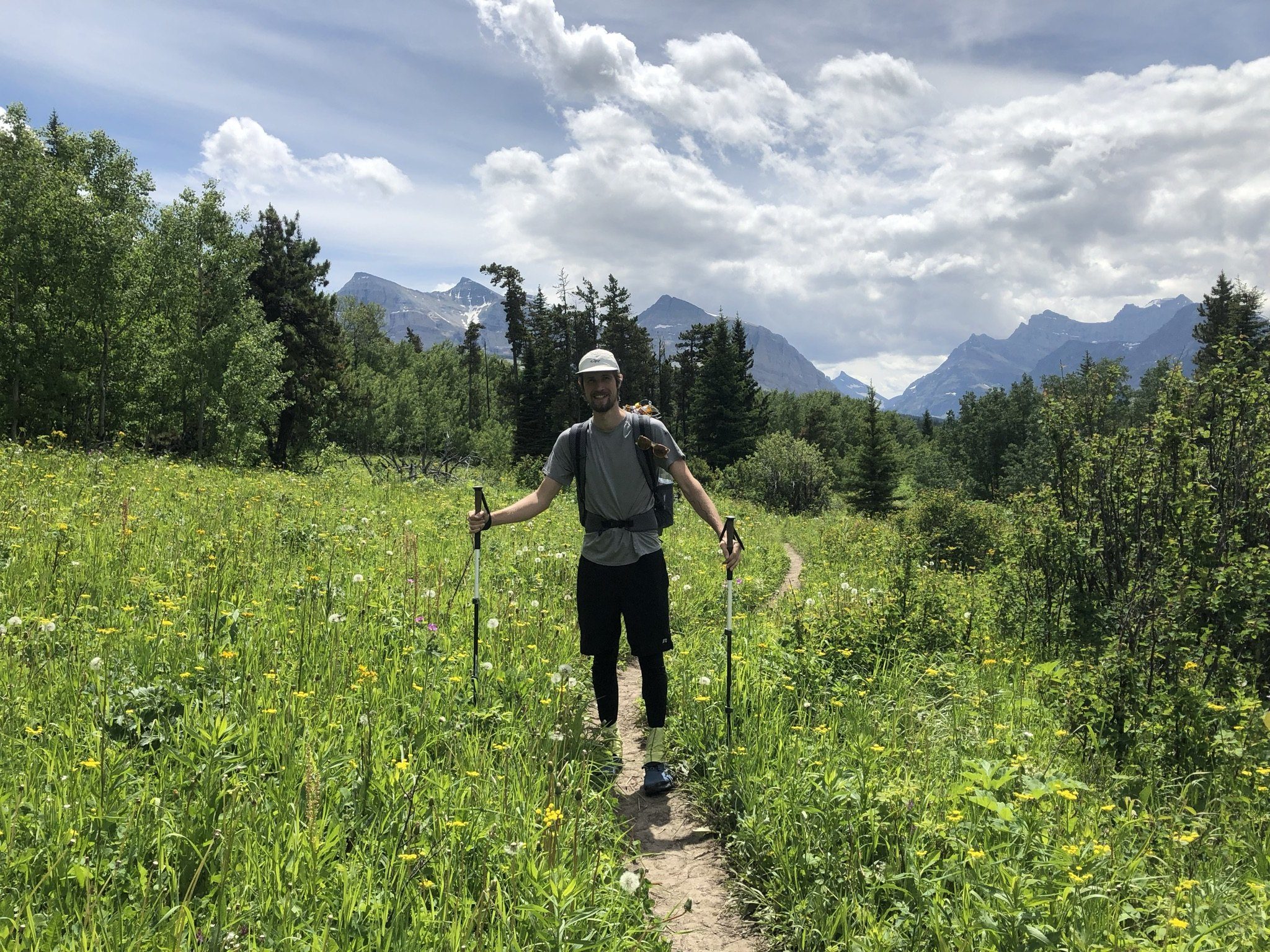 Hiker walking a high open trail