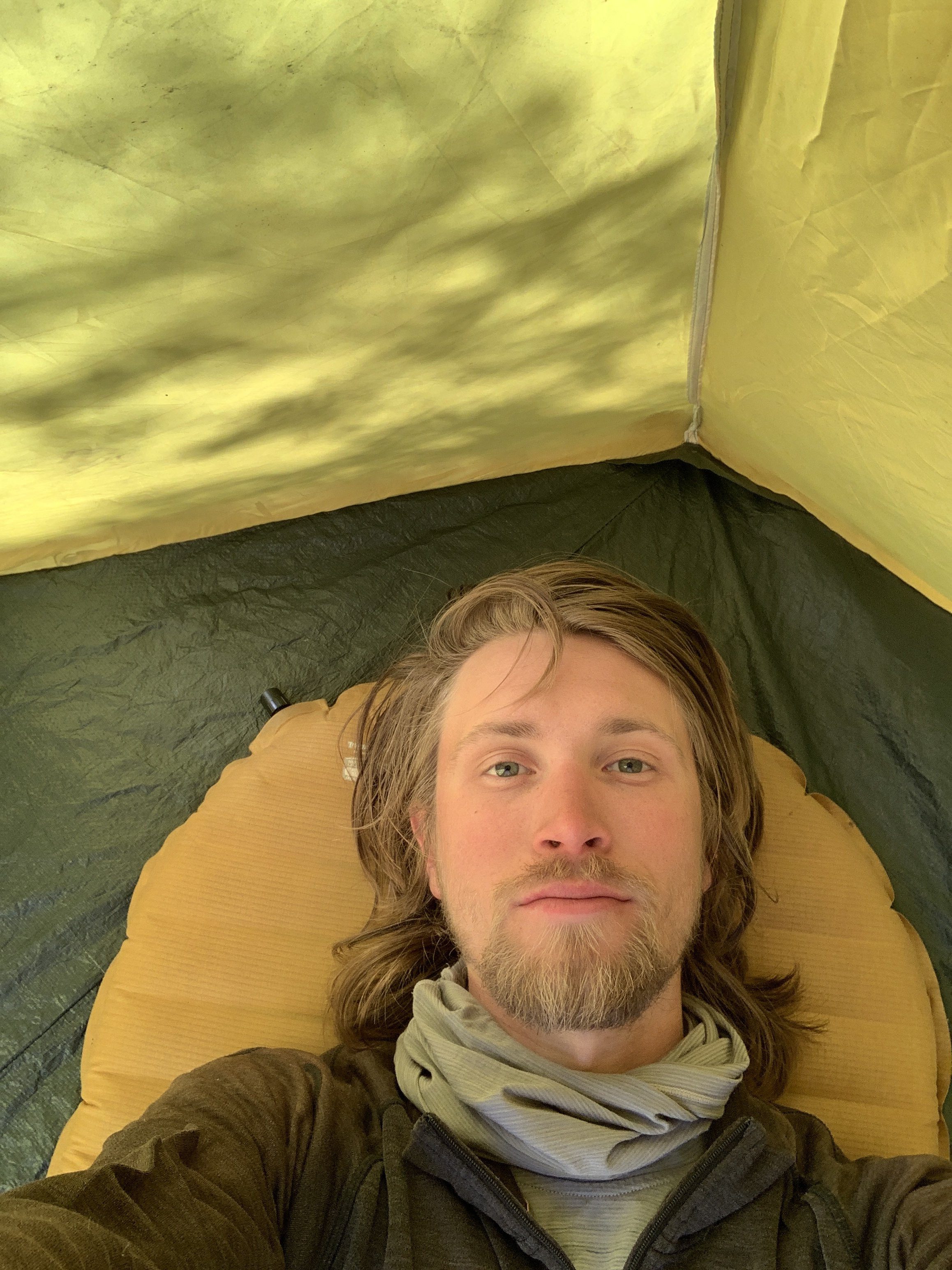 Tent campsite with heavy morning frost in Mississippi pine country