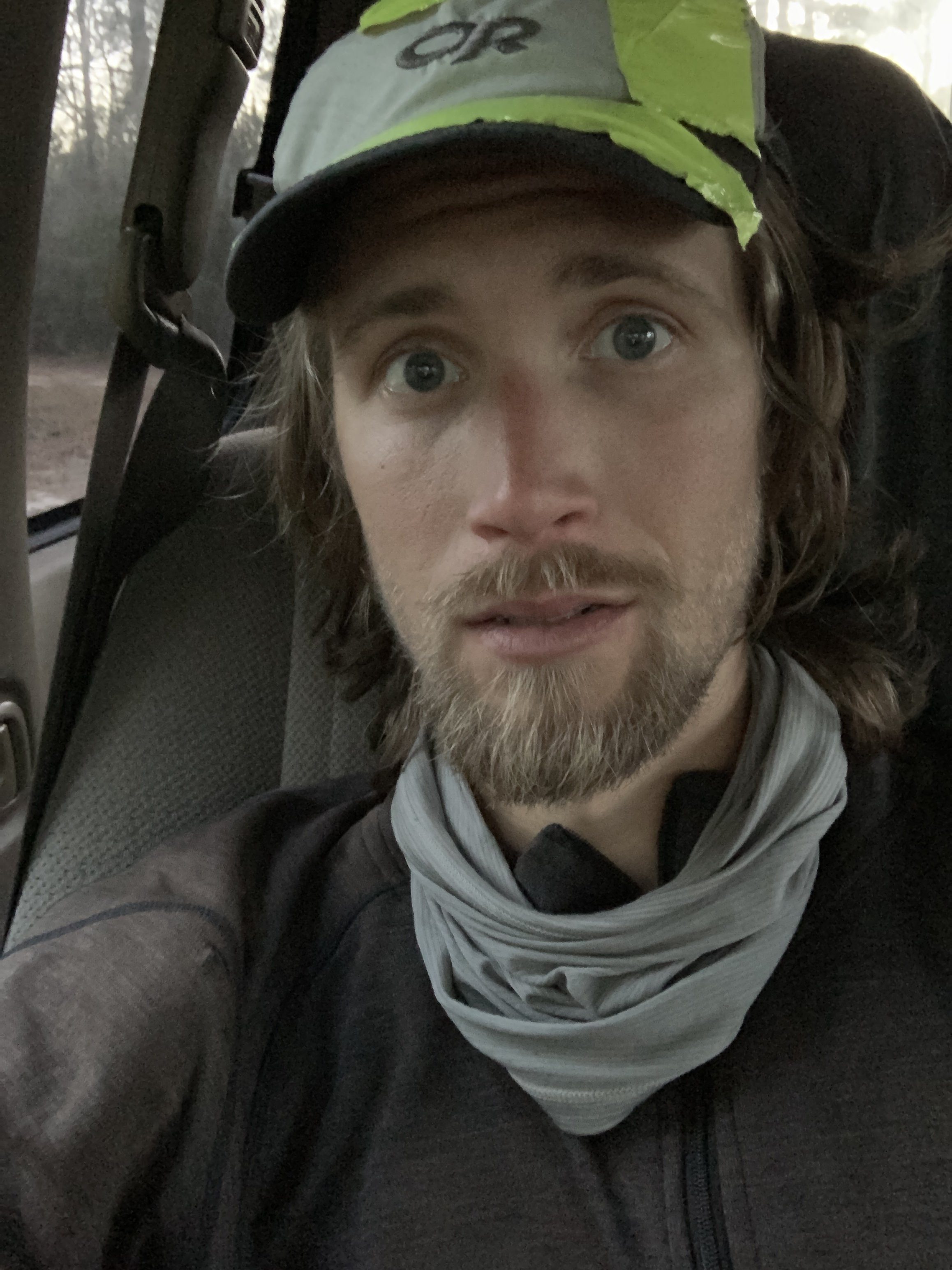 Jeremy in front seat of vehicle post-finish after 40-mile endurance run